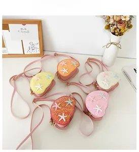 Five assorted glitter crossbody bags for girls with starfish details and gold chains