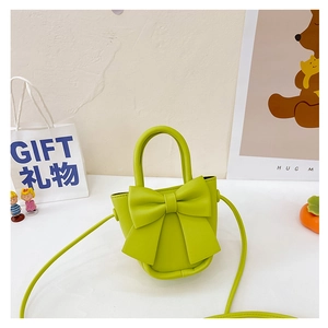 Lime green mini handbag with large bow detail and long shoulder strap for girls