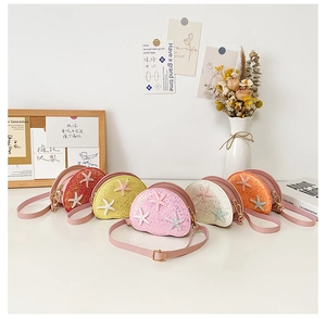 Detail showing colorful sequin girls crossbody bags with cute starfish decorations