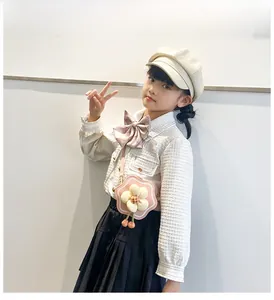 Pink wave-edged flower crossbody bag for girls with 3D floral and cherry details