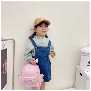 Pink preschool backpack featuring a glittery heart sequin pocket and cute side wings