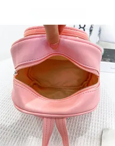Interior view of pink mini PU leather backpack showing the main compartment and lining