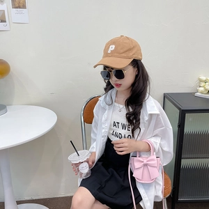 Fashionable pink mini bow handbag with crossbody strap and stylish accessories for girls
