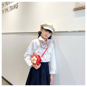 Detail of red 3D flower crossbody bag for girls styled with a sweet preppy outfit