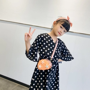 Girl polka dot dress with orange shell-shaped sequin crossbody bag and headband