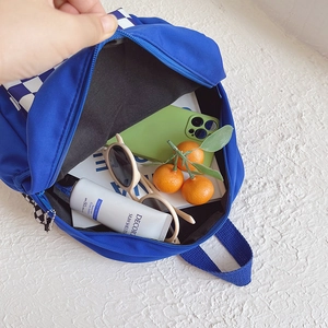 Blue kids backpack with checkerboard pattern and spacious interior for daily essentials