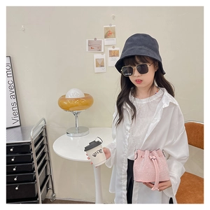 Pink rhinestone bucket bag shown with trendy children fashion accessories and casual outfit