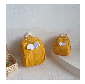 Detailed comparison of two yellow backpacks with 3D white wings in different sizes