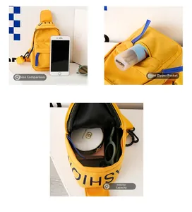 Detail view of yellow canvas chest bag showing blue zipper and spacious inner storage