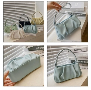 Close-up of pleated PU leather underarm cloud bag in multiple pastel colors