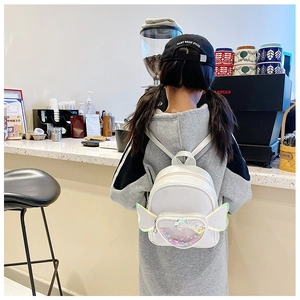 Detail view of white toddler backpack with laser wing decor and sequin heart window