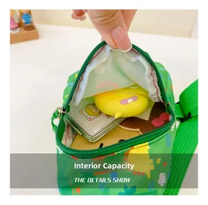 Detail showing the spacious interior of the cartoon dinosaur crossbody bag for kids