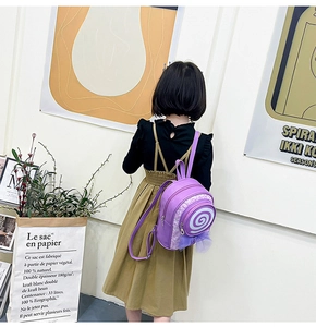 Toddler purple lollipop backpack with spiral pattern and purple mesh bow on back