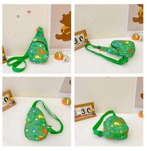 Detail view of green canvas kids chest bag featuring colorful cartoon dinosaur prints