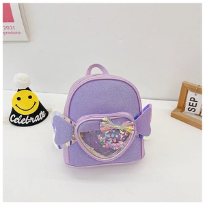 Detail of purple glitter backpack with heart-shaped sequin pocket and iridescent wings