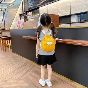 Cute yellow mini canvas backpack for kids featuring bear wings and Good Luck print