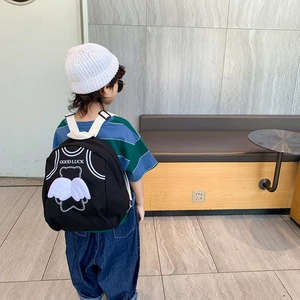 Cute black canvas kids backpack with white 3D wings and Good Luck text detail