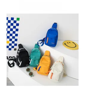 Detailed view of colorful canvas crossbody chest bags for kids in five trendy colors