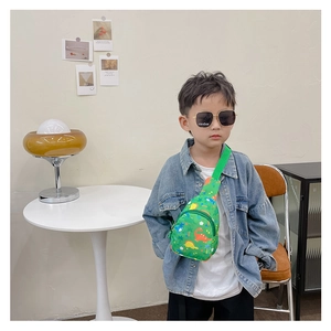 Close-up of cute cartoon dinosaur print on lightweight canvas crossbody bag for boys