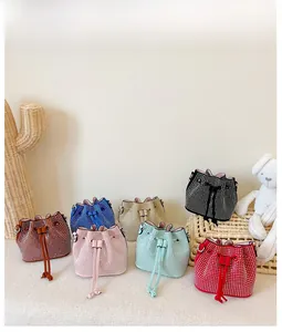 Detailed view of assorted rhinestone bucket bags with drawstring closure and chain strap