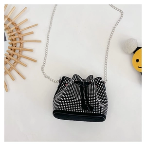 Detail of black rhinestone bucket bag with silver chain strap and drawstring closure