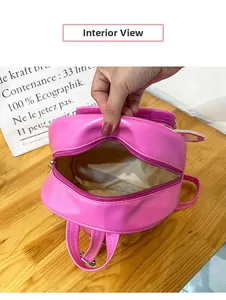 Interior view of the pink heart sequins backpack showing smooth fabric lining and space