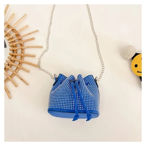Detail view of royal blue bucket bag with silver rhinestones and chain strap
