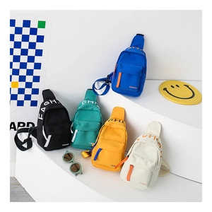 Detailed display of five colorful canvas mini crossbody bags with FASHION logo straps