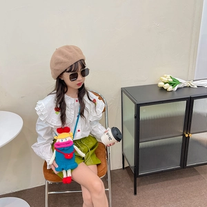 Girl's strawberry embroidered ruffle shirt with green leather skirt and knit doll bag