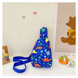 Close-up of vibrant blue kids chest bag featuring colorful cartoon dinosaur prints and zippers
