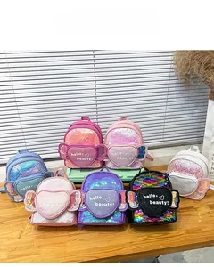 Close-up of kids sequin backpacks with 3D heart-shaped pocket and glitter wings