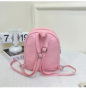 Rear view of pink PU leather toddler backpack showing adjustable straps and metal buckles