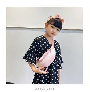 Close-up of pink faux leather kids' chest bag with metal zipper and adjustable strap