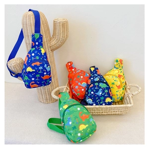 Detail showing four colorful canvas crossbody bags with cartoon dinosaur prints for kids