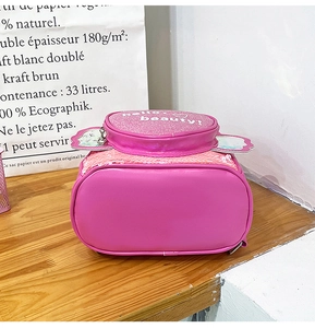Close-up of pink sequin kids backpack with hello beauty text and iridescent wings