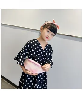 Pink gradient children's waist bag set with matching bow headband shown on a model