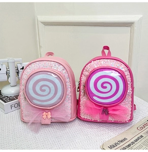Detail showing two sequin girls' backpacks in pink and rose with lollipop pockets