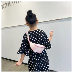 Pink and white gradient kids waist bag with adjustable strap shown on small child