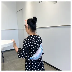 Detail of colorful gradient crossbody chest bag for kids with adjustable blue strap