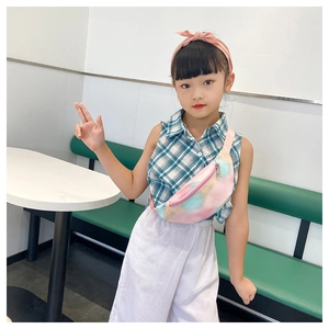 Toddler girl wearing a colorful gradient PU crossbody chest bag in a modern cafe setting
