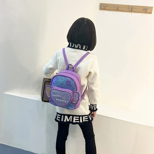 Cute purple sequin backpack for girls with heart pocket and butterfly wing accents