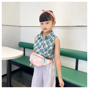 Close-up of kids colorful gradient PU leather waist bag with lychee texture and zipper