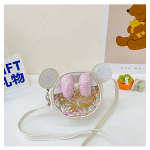 Détail du joli sac bandoulière rond pour filles avec oreilles à paillettes et nœud rose