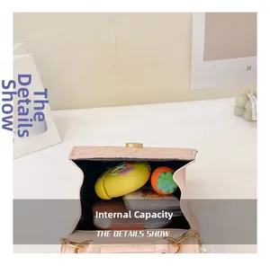Internal capacity of pink bow handbag showing storage for accessories and cards