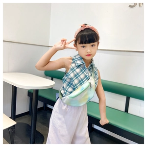 Detail of colorful children's waist bag styled with macaron tones and casual summer outfit