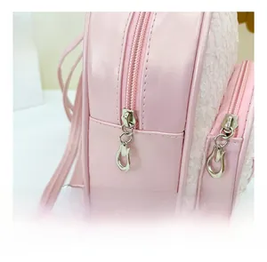 Detailed close-up of the smooth zipper and sequin stitching on this pink toddler backpack
