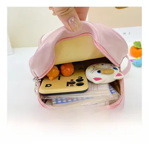 Detail view of pink mini bag interior showing capacity for phone and accessories