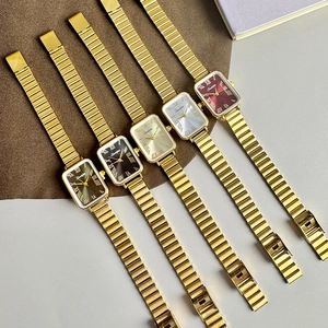Women's rectangle quartz watch set with roman numerals and gold link bracelets