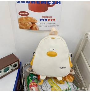 Close-up of cute white duck canvas backpack with mingdiandian text in metal shopping basket