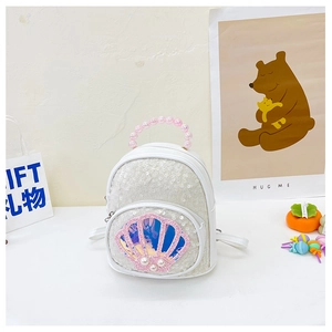 Detailed view of kids sequin backpack with pink shell design and pearl bead handle